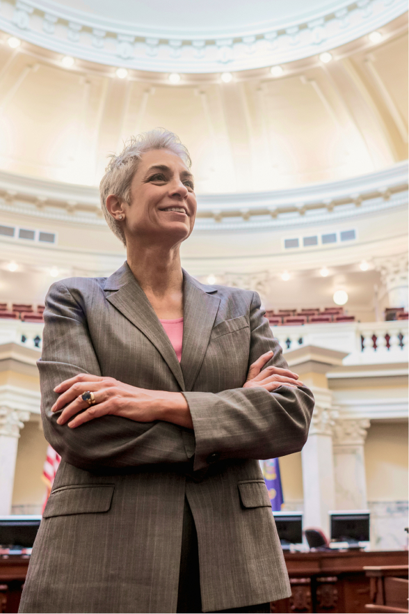 A politician with their arms folded